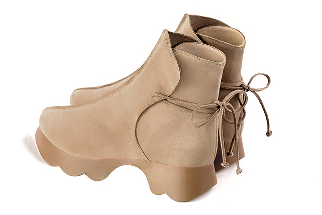 Tan beige women's ankle boots with laces at the back.. Rear view - Florence KOOIJMAN